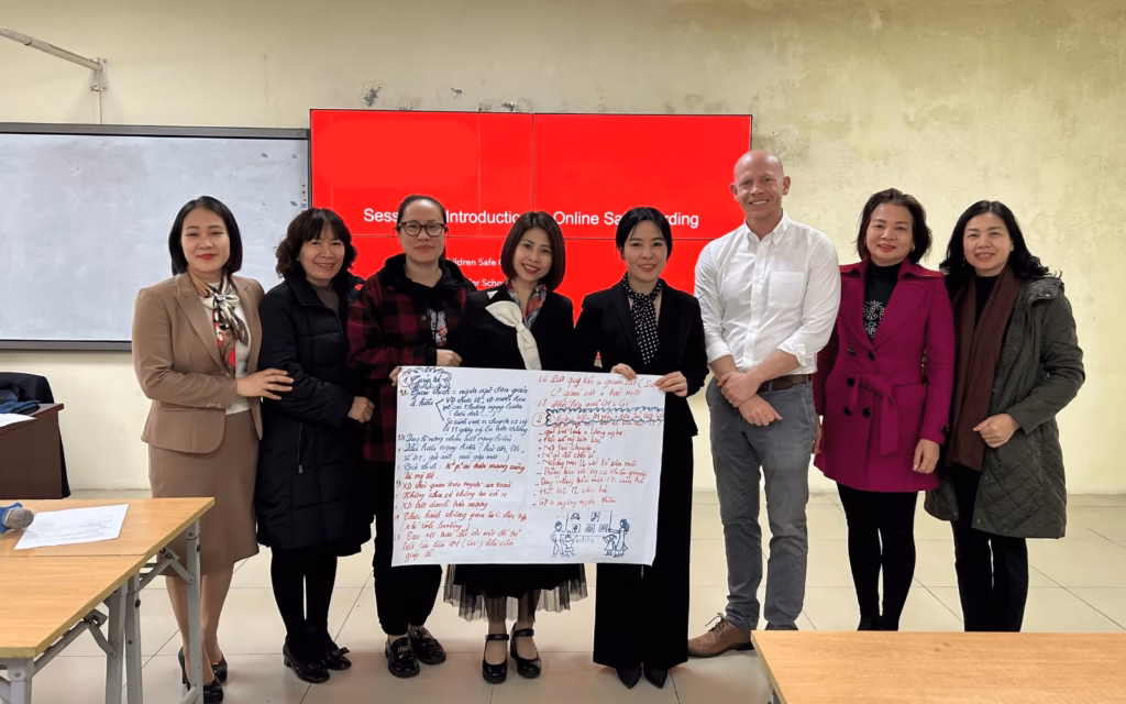 Joshua James with school principals after an online safeguarding session in Hanoi