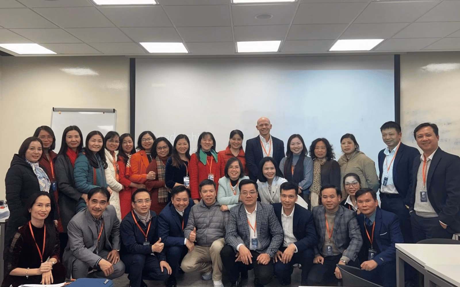 Joshua James with school principals at a leadership and safeguarding training programme in Hanoi